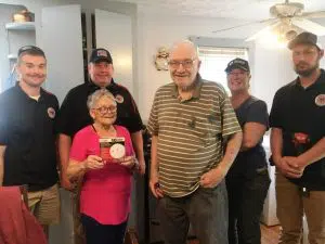 On Saturday the American Red Cross and the DeKalb County Volunteer Fire Department teamed up for a “Smoke Alarm Blitz”. Teams fanned out across the county to install smoke alarms at 130 addresses including at the home of Clay and Sharon Farler on South College Street, Smithville. Pictured here with Mr. and Mrs. Farler are Luke Green (DCFD), DCFD Chief Donny Green, Cindy Pankowski (American Red Cross Volunteer) and Blake Reffue (DCFD)