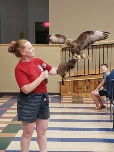 Mary Beth showing off one of Bob Tarter's Animalogy Critters at Summer Reading Party