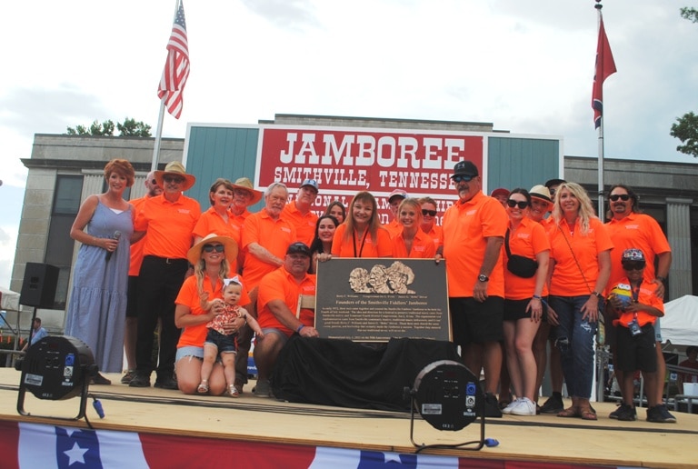 Members of the James G. “Bobo” Driver family gathered on-stage of the Fiddlers Jamboree Saturday to unveil a marker to be placed on the courthouse grounds commemorating three founders of the Jamboree in 1972 including Mr. Driver, Berry C. Williams, and Congressman Joe L. Evins, all of whom passed away many years ago