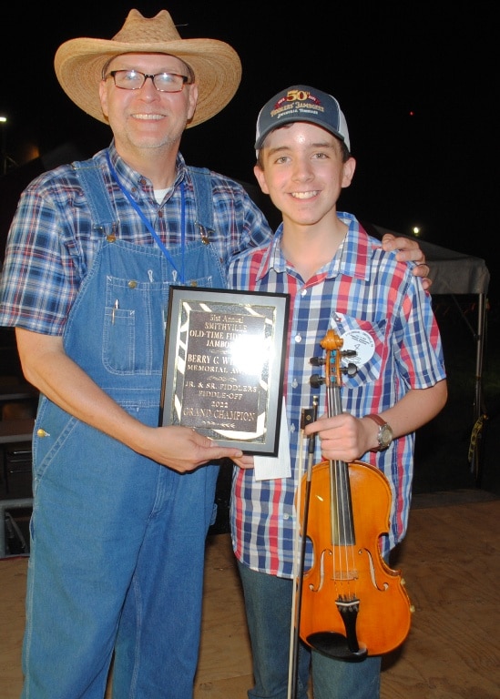 13 year old Noah Goebel has claimed the Grand Champion Fiddling Title at the 51st edition of the Smithville Fiddlers Jamboree and Crafts Festival. Sam Stout, President and Coordinator of the Fiddlers Jamboree presented the award to Goebel at the conclusion of the festival which ended at 11: 30 p.m. Saturday evening.