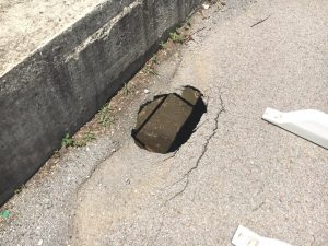 Although it remains partially open to traffic, a small bridge over Dry Creek Road just off West Broad Street has a gaping hole through it and is in need of replacement.