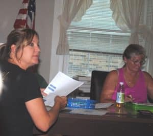 Liberty Alderman Kendra Stanford makes point during town council meeting Monday night. Mayor Audrey Martin seated to the right