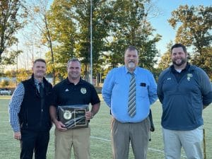 A brief dedication observance was held in October at the “Dylan Kleparek Coach K Soccer Field” at DeKalb County High School. It comes almost a year after the Board of Education named the field for the legendary Tiger and Lady Tiger soccer coach. Pictured left to right: Director of Schools Patrick Cripps, Coach K, DCHS Principal Bruce Curtis, and Assistant DCHS Principal Thomas Cagle