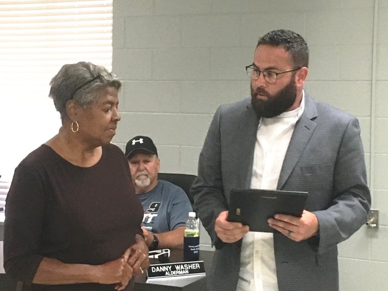 The Smithville Mayor and Aldermen Monday night paid tribute to a long-time member of the planning commission and board of zoning appeals who passed away in August. Mayor Josh Miller presented a plaque to Jackie Smith, wife of Wade Smith, Jr.