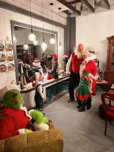 Christmas on the Square “FIRST PLACE Live Window Winner goes to “The Attic on Walnut” for their Santa’s Workshop complete with Santa & Mrs. Clause, lots of little hardworking elves, and The Grinch! (Provided by Chamber of Commerce)