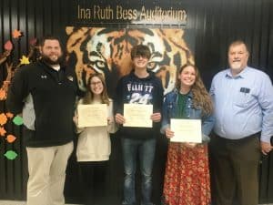 DeKalb County High School continued its monthly observance Tuesday of recognizing a teacher, student, and parents or guardians of the month for December. Each received a certificate from the school and a gift card for a meal from KFC/Taco Bell. Pictured left to right- Assistant DCHS Principal Thomas Cagle, Student of the Month Alyssa Pugh, Jamison Bare, who wrote a winning essay nominating his parents Dana and Joshua Bare as Parents of the Month, Lindsay Kennedy, Teacher of the Month, and DCHS Principal Bruce Curtis.