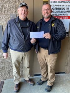 The DeKalb County Sheriff's Department D.A.R.E. program was presented with a $500 donation Wednesday from the Mountain Harbour Property Owners Association (POA). Pictured are Pete Siggelko of the Mountain Harbour Property Owners Association with Sheriff Ray.