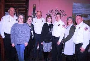 Four longtime leaders of the Smithville Fire Department received new officer badges marking their promotions which were formally announced last October. With the new rankings Former Captain Jeff Wright is now Assistant Chief and former Lieutenants Danny Poss, Donnie Cantrell, and John Poss have been promoted to Captains. Their badges were pinned on them Monday night by their spouses Nicole Wright, Pamela Poss (Danny’s wife), Pat Cantrell, and Lori Poss (John’s wife). Pictured left to right: Jeff Wright, Nicole Wright, Pamela Poss, Danny Poss, Lori Poss, John Poss, Pat Cantrell, and Donnie Cantrell. The recognition came Monday night during an appreciation dinner for city firefighters at Ace’s Steakhouse, Seafood, and Italian Restaurant downtown.