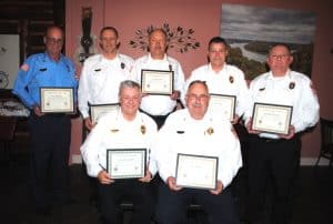 Outstanding service awards were presented Monday night to members of the Smithville Fire Department including the longest serving as pictured here seated left to right: Chief Charlie Parker- 43 years of service including 31 years as Chief and Deputy Chief Hoyte Hale-38 years of service. Standing left to right- William (Wink) Brown-25 years, Assistant Chief Jeff Wright-37 years, Captain Danny Poss-43 years, Captain John Poss-32 years, and Captain Donnie Cantrell-43 years of service