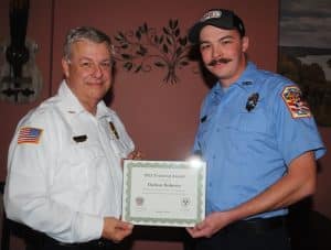 Dalton Roberts (right), one of the Smithville Fire Department’s three full time paid fighters employed by the city, received a Training Award for logging the most training hours during 2022 at 141 hours. Chief Charlie Parker presented the award to Roberts Monday night during an appreciation dinner for city firefighters at Ace’s Steakhouse, Seafood, and Italian Restaurant downtown.