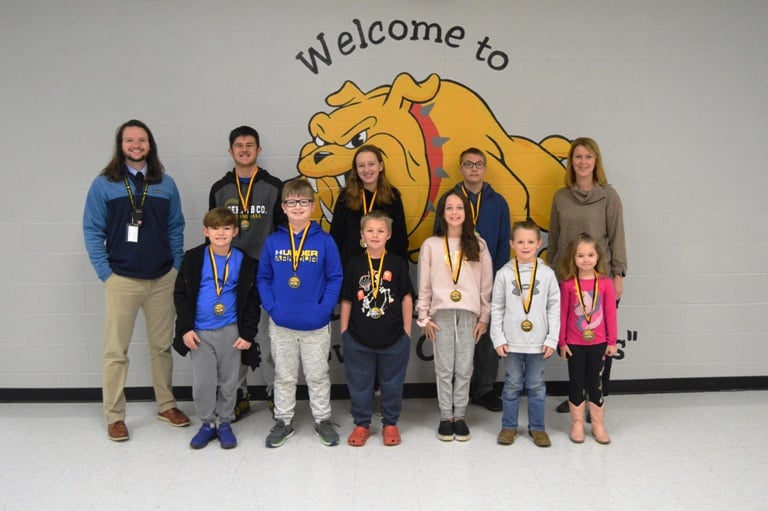 DeKalb West School Students of the Month for January. Pictured front row left to right are Mason Checchi, Holden Leiser, Braylin Niffen, Hailey Brown, Maddy Lattimore, and Maddie Ellis. Back row left to right are Assistant Principal Seth Willoughby, Porter Hancock, Kate Pistole, Wyatt Young, and Principal Sabrina Farler.