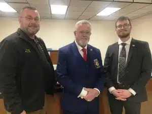 Tennessee Corrections Institute Deputy Director Bob Bass (center) with County Mayor Matt Adcock (right), and Sheriff Patrick Ray (left) at previous meeting
