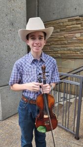 13-year-old Noah Goebel, Grand Champion Fiddler at the 51st Smithville Fiddlers Jamboree and Crafts Festival will be playing Saturday, January 28, 2023 at the Ryman Auditorium.