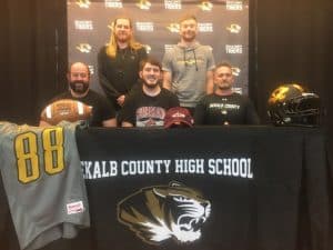 DCHS Senior Tiger punter Nolan Gottlied is about to kick his football career up a notch! The 2022 special teams’ player of the year for the Tigers and the Region 4 Class 4A Most Outstanding Punter, gathered with family, friends, coaches, and fellow players at DCHS Friday, February 10 to sign a letter of intent to play for Cumberland University after he graduates in May. Pictured here are Nolan and DCHS Tiger Football Coaches seated left to right: Tiger Assistant Coach Michael Shaw, Nolan Gottlied, and Tiger Coach Steve Trapp. Standing left to right- Assistant Tiger Coaches Kason Wheeler and Luke Green.