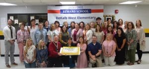 Cut the cake. It’s time to celebrate! Kudos to the students and staff at DeKalb West School for recent academic growth. Staff at the school recently gathered for the celebration with the cutting of a cake. “We are celebrating DWS being named a Reward School for the 2021-2022 school year. They were a level 5 out of 5 school in growth, achievement and attendance for the 2021-22 school year,” said Supervisor of Instruction Dr. Kathy Bryant