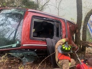 According to the Tennessee Highway Patrol, Bryan K. Boring was traveling southbound on Sligo Road (the entrance road off Highway 70 east to Sligo Marina) in a 2016 Ford Escape attempting to negotiate a left turn when he ran off the right side of the road into the parking lot. The car then went over a concrete traffic barrier, overturned, and rolled over a steep embankment until it came to final rest on its side in between two trees on the side of the bluff near the lake. (DeKalb Sheriff's Department Photo)