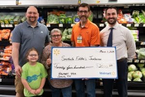 Local Walmart awards grant to Smithville Jamboree : Pictured from Left to Right: Alex Woodward -Marketing Director; Ainsley Woodward, Kim Luton - President; Steve Abell, Jr. - Walmart Store Manager, Grant James - Treasurer