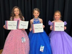 Miss Jamboree age 7-10: Shaniya Bates (LEFT), 9-year-old daughter of Tom and Chyna Bates of Liberty won optional awards for Prettiest Hair and Most Photogenic. Nine-year-old Makenna Grace Billings of Sparta, daughter of Blake and Makayla Billings (CENTER) was awarded for Prettiest Eyes. Ansley Snow (RIGHT) received an award for Prettiest Attire. She is the 7-year-old daughter of Andy and Laura Snow and Ashleigh and Seth Braseel of Dowelltown.