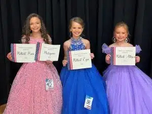 Miss Jamboree age 7-10: Shaniya Bates (LEFT), 9-year-old daughter of Tom and Chyna Bates of Liberty won optional awards for Prettiest Hair and Most Photogenic. Nine-year-old Makenna Grace Billings of Sparta, daughter of Blake and Makayla Billings (CENTER) was awarded for Prettiest Eyes. Ansley Snow (RIGHT) received an award for Prettiest Attire. She is the 7-year-old daughter of Andy and Laura Snow and Ashleigh and Seth Braseel of Dowelltown.