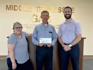 Pictured: Kim Driver Luton, Jamboree President; Mike Corley Middle Tennessee Natural Gas; Grant James, Jamboree Treasurer