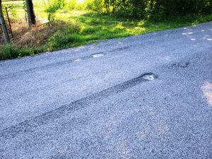 DeKalb Highway Department Offers Reward for Arrest and Conviction of Those Damaging County Roads due to Vehicle “Burnouts”. Photo shows one of several locations where damage was done to Big Woods Road