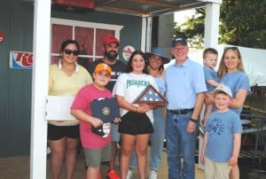 Congressman John Rose and his family greeted the family of Jeremy Bell of Australia who recently moved here and acquired a business. Congressman Rose presented them a flag for having hailed from the longest distance internationally to be in Smithville for the Jamboree.