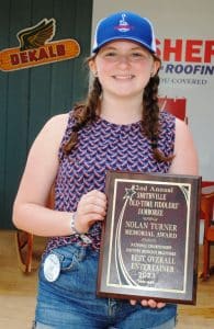 Reagan Brown of Springfield repeated as winner of the Nolan Turner Memorial Entertainer of the Year award in the Fiddlers Jamboree's Beginners competition. The honor is presented to the best overall instrumental entertainer among winners in the dobro guitar, mandolin, five string banjo, and flat top guitar competition. Turner, who died in October 2017, was a long time Fiddlers’ Jamboree supporter and photographer. Brown won the Mandolin competition, received second place in the Dobro and Flat top guitar category, and Third Place in the Five String Banjo contest.
