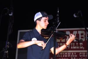 Grand Champion Fiddler Noah Goebel of Elkton, Kentucky also won the Junior Fiddling and Contest Fiddle (Neil Dudney Memorial Award)