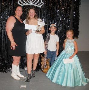 Veronica Johnson and her daughter Alexis Grace Atnip (pictured together at left) won the 2023 Lip Sync Battle at the DeKalb County Fair Friday night. Coming in second place was Jack Harvey (second from right). Haddeigh Grace Harvey (far right) took third place.