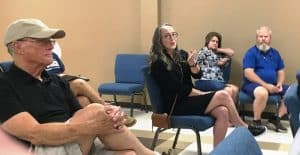 Jennifer Bright, a resident of Clear View Drive (shown seated center in glasses) addressed County Commission Thursday night about proposed County Powers Act and health and safety property standards
