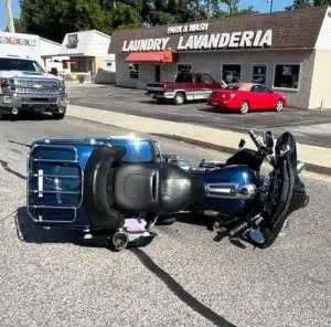 A motorcycle operator was injured after his bike collided with a John Deere Tractor Monday morning on West Broad Street near Anthony Avenue. (Jim Beshearse Photo)