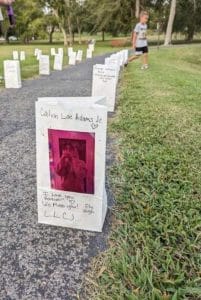 Walking trail lined with paper glow bags Friday in honor and remembrance of those lost to overdose