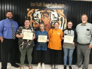 DeKalb County High School renewed its monthly observance Thursday of recognizing a teacher, student, and parent of the month for August. Each received a certificate from the school and a gift card for a meal from El Rancho. Pictured left to right: Assistant DCHS Principal Thomas Cagle; Hope Carter, Comprehensive Development Classroom (CDC)/Special Education educator (Teacher of the Month); Senior Brynn Harvey (Student of the Month), Olivia and Annaly Diego, daughters of Paula Diego (Parent of the Month); and DCHS Principal Bruce Curtis. Annaly, a Freshman, wrote the essay about her mother that won the award. Her sister Olivia is a Senior at DCHS. Their mother Paula was unable to attend the award presentation Thursday.