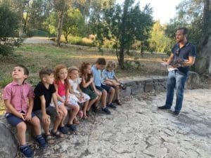 Pastor Dan Coe giving instruction to children