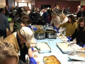 A large group of caring people from the community gave up part of their Thanksgiving Day to see that hundreds of their needy friends and neighbors had a hot delicious meal on this special holiday.