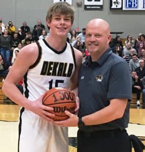 DCHS Basketball Senior Conner Close Scored his 1,000th Career Point Tuesday night, December 12. Pictured with Tiger Head Coach Joey Agee