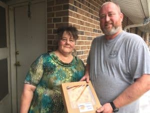 Chief Deputy Brian Williams of DeKalb Sheriff’s Department makes meal delivery to Mary Smith Saturday in time for Christmas on behalf of the DeKalb Emergency Services Association. Williams and many other volunteers delivered meals to 870 people in 238 households across the county