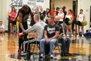 Harlem Wizards call on locals to participate in a basketball trick