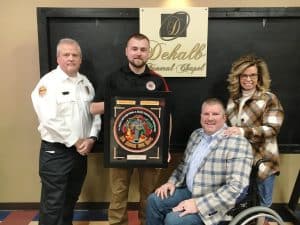 The 2023 DeKalb County Fire Department’s “Git R Done” Award went to Justin Bass of the Main Station. . Wilson Bank & Trust was the program headlining sponsor of the annual awards banquet held Saturday night. Pictured left to right: Presenter Captain Blake Cantrell, Git R Done Award winner Justin Bass and Michael and Tara Hale of DeKalb Funeral Chapel