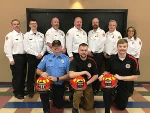 The DeKalb County Volunteer Fire Department announced the promotion of three firefighters to the officer position rank of Lieutenant, including Andrew Harvey, Justin Bass, and Luke Green pictured (left to right) kneeling with their helmets. Other longtime county fire department officers standing left to right are: Lieutenant Dusty Johnson, Lieutenant Matt Adcock, Captain Brian Williams, Chief Donny Green, Assistant Chief Anthony Boyd, Captain Blake Cantrell, and Lieutenant Kristie Johnson.