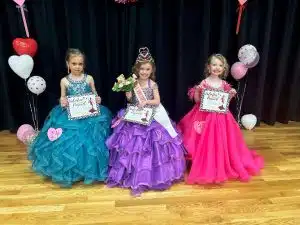 Valentine Pageant Saturday: Anna Lee Brelje of Alexandria (pictured center) was crowned queen in the 4–6-year-old category. She is the 5-year-old daughter of Andy and Whitney Brelje. Anna Lee is a pre-school student at Outreach Pre-School. Runners-up in this division were 1st-Annabelle Bowen of Liberty (right), 4-year-old daughter of Jacob and Kayla Bowen; and 2nd- Briar Kilgore of Smithville (left), 5-year-old daughter of Clay and Mariah Kilgore. Annabelle Bowen was judged to have the prettiest eyes.