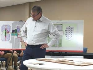 John Eisenlau of Treanor Architects addressed county commission about jail/judicial center options with schematic site plans displayed behind him