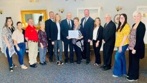 Chamber Honors Love-Cantrell Funeral Home with 65-Year Milestone Award Pictured l-r; Smithville Alderman Beth Chandler, Mallory Pfingstler, Smithville Alderman Shawn Jacobs, Chamber Board Member Kathy Hendrixson, Love-Cantrell staff - Neal Brown, Renee Hennessee, owners Deloy and Diane Kirby, Chad Kirby, Shelia Kirby, Joey Phillips, Chamber Board Member Sarah Crowe, and Chamber Director Suzanne Williams. Not pictured: Love-Cantrell staff- Ricky Atnip, Jeremy Judkins and Chris McMillen.