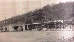 Photo shows damage to the Dowelltown Manufacturing Company (shirt factory) after the storm 50 years ago