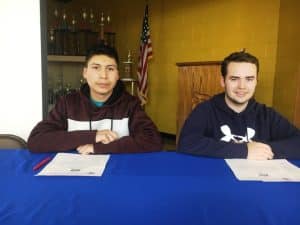 DCHS Seniors Jared Hernandez Balderas (left) and Samuel Moore sign with TCAT McMinnville in Computer Information Technology