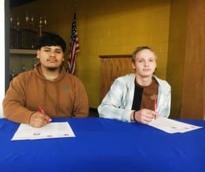 DCHS Seniors Samuel Gaspar (left) and Trinten Summers sign with TCAT McMinnville in Automotive Technology