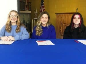 (Left to Right) DCHS Seniors Madison Dawson, Emily Satterfield, and Sarah Boner sign with TCAT McMinnville in Cosmetology