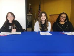(Left to Right) DCHS Seniors Rashelle Miller, Kayleigh Overstreet, and Kilah Terry sign with TCAT McMinnville in Cosmetology