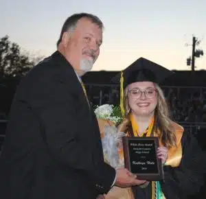 DCHS Principal Bruce Curtis presents White Rose Award to Kathryn Hale during Class of 2024 Graduation Friday night