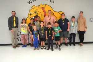 DeKalb West School Announces April Students of the Month. Pictured front row left to right: Noah Ellis, Weston Hancock, Oliver Moore, and Elijah Pitt. Back row left to right: Assistant Principal Seth Willoughby, Vaylee Ellis, Katy Jo Bowen, Bella Gonzalez, Camille Barton, Zane Griffith, Karson Mullinax, and Principal Sabrina Farler.